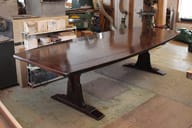 braced arch dining table in walnut