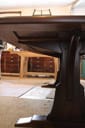braced arch dining table in walnut