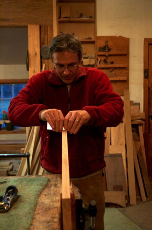 Peter Maynard working in shop
